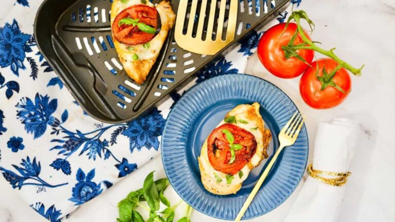 Caprese chicken on a plate.
