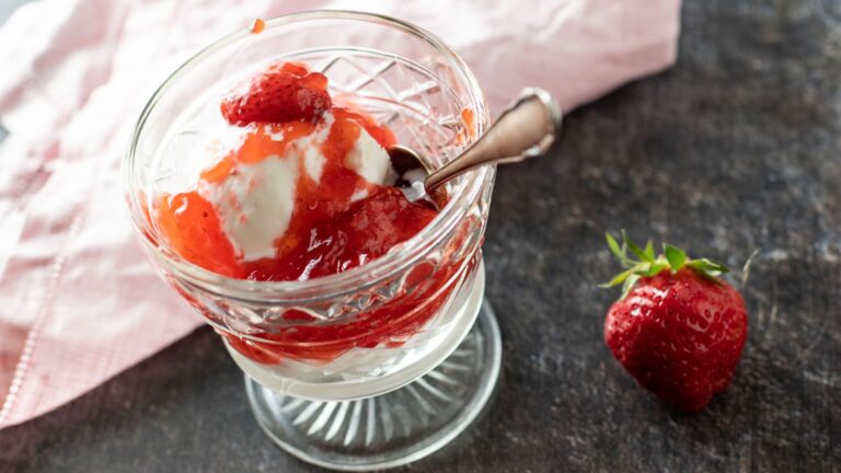 Strawberry pie filling in a glass.