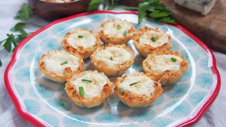 Crab cups on a blue and white plate.