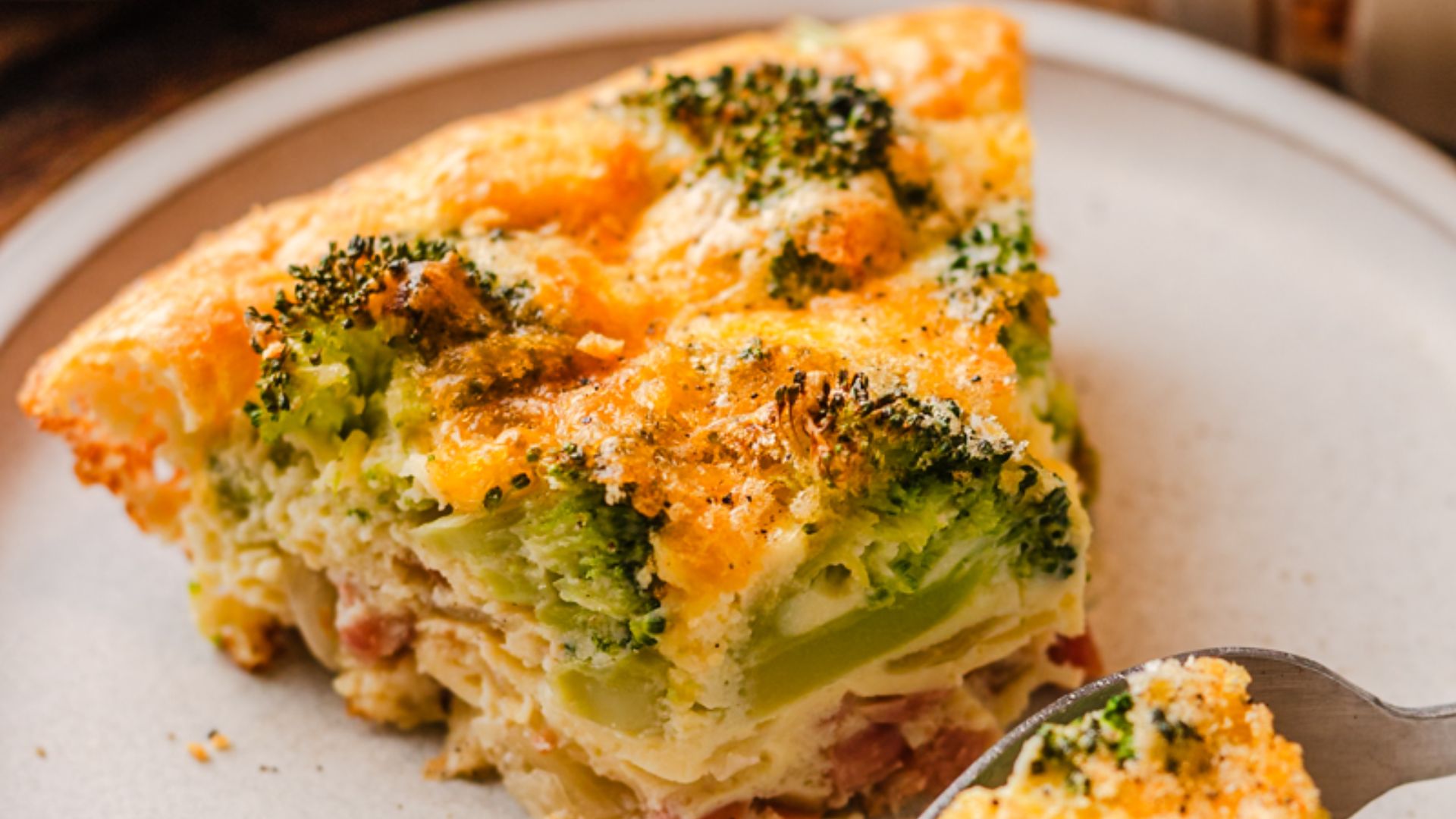 A slice of ham and cheese on a plate.