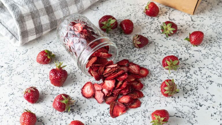 Strawberries spilled out the jar.