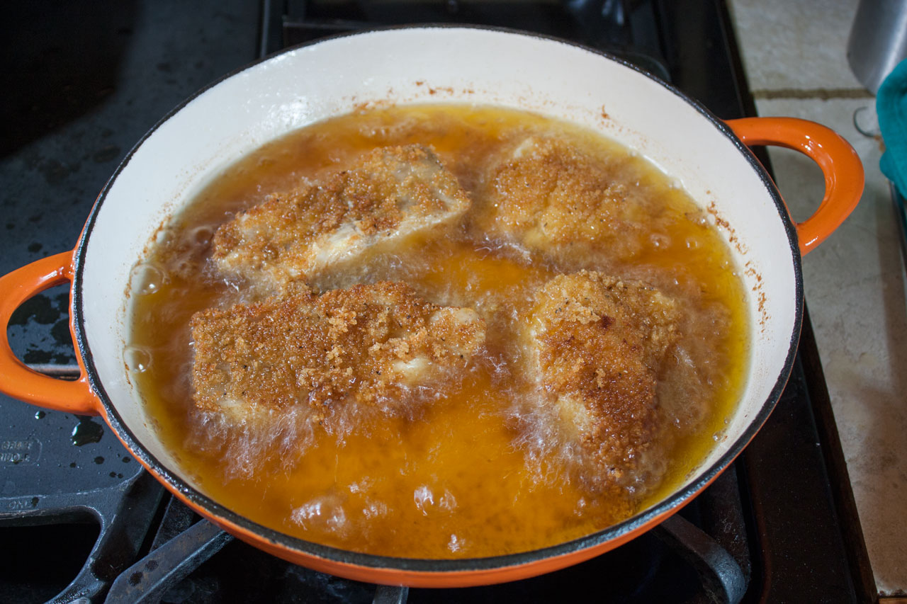 Shallow frying filets in a large cast iron skillet.
