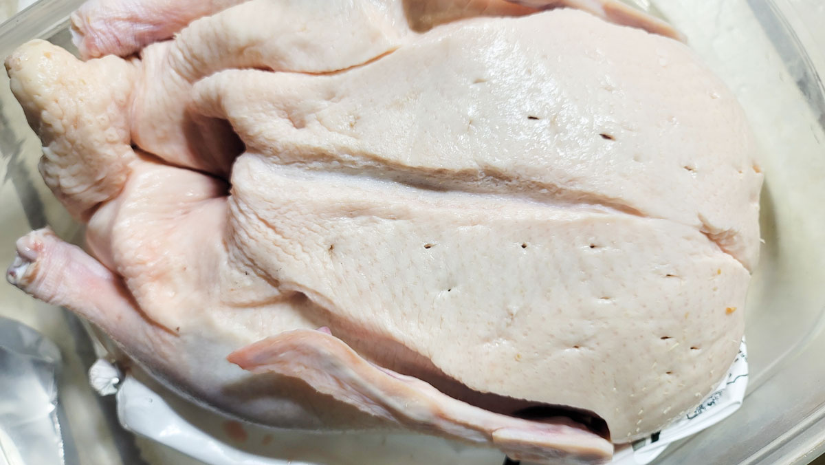 Holes visible in the skin of the duck.