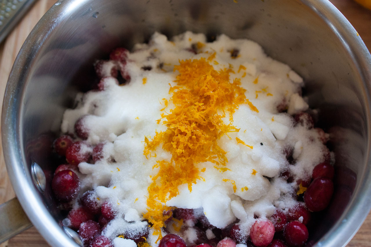 Orange zest added to the saucepan.