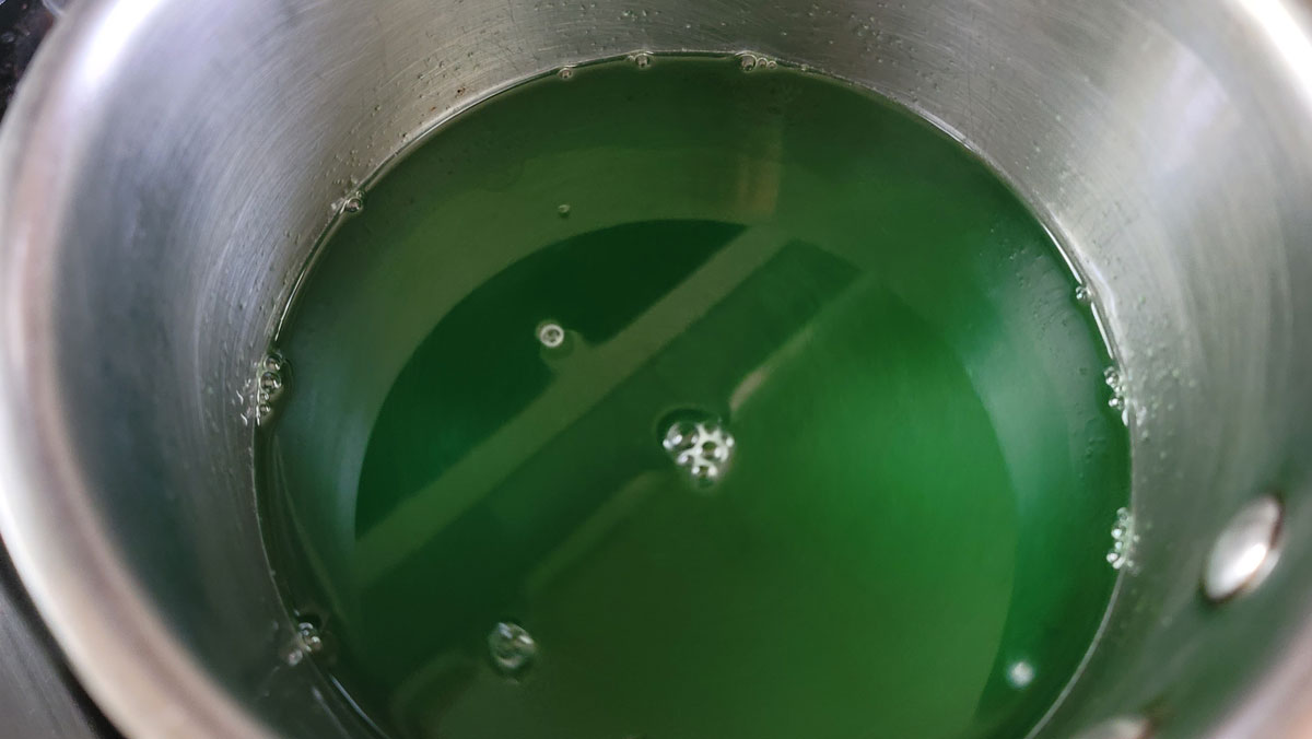 Mixing the jello and water in a bowl.